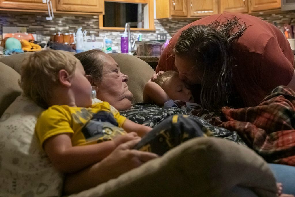 Second place, Chuck Scott Student Photographer of the Year - Chris Day / Ohio UniversityMangus Shaulis and Danita McLaughlin look at Melanie Shaulis as she kisses Silas Shaulis goodbye before heading to work in the morning. Danita said her favorite time of day is when they lay on her in the mornings as they're waking up. "I know they'll be too big for that one day," she said. "It's a grandma thing."