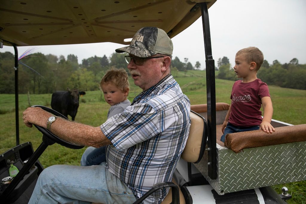 Second place, Chuck Scott Student Photographer of the Year - Chris Day / Ohio UniversityChris McLaughlin takes Mangus and Silas Shaulis down to visit his cows on Sept. 21, 2021. On Thursdays and Fridays, Chris and Danita’s two older grandchildren get off the school bus at their home before their dad comes to pick them up.