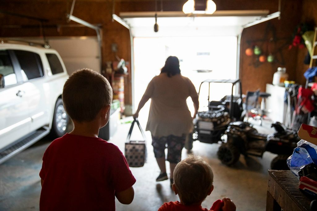Second place, Chuck Scott Student Photographer of the Year - Chris Day / Ohio UniversitySilas and Mangus Shaulis watch as Danita McLaughlin heads back to her house after a day of looking after them on Sept. 23, 2021. Chris had said, while he knows they'd figure something out, he's not sure what his two daughters would have done if Danita wasn't there every day to watch the children while they worked.