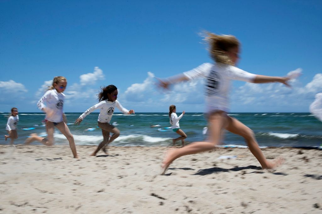 Second place, Chuck Scott Student Photographer of the Year - Chris Day / Ohio UniversityShawn Freas, 7, leads in a race for the last net in North Ocean Park at Pompano Beach as part of the Living Water Surf School on Thursday, June 10, 2021. Thursday is the first day of summer for Broward County students. Freas defeated the other girls and then went on to win against the quickest boys to be crowned the fastest person in the group. 