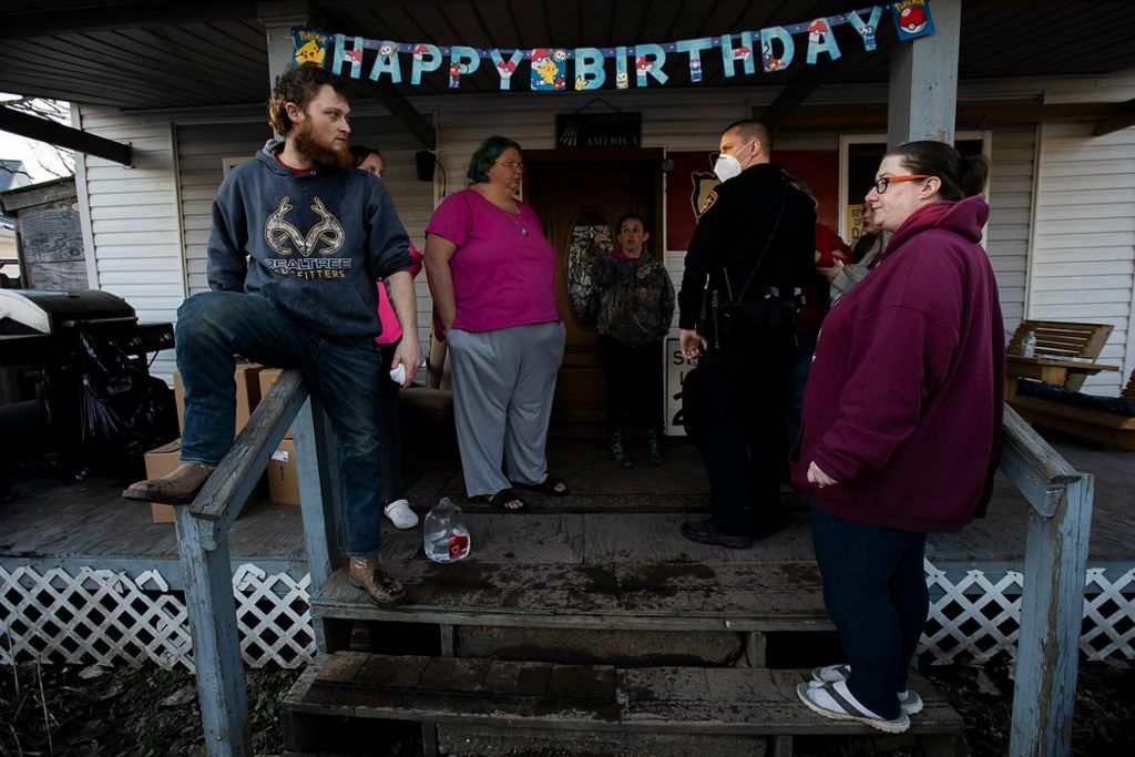 Second place, Chuck Scott Student Photographer of the Year - Chris Day / Ohio UniversityAn Athens County Sheriff's deputy speaks to attendees of a birthday party in New Marshfield after Kody Cummings, left, and three others were pepper sprayed by a neighbor on Saturday, February 6, 2021. Tina Osborne and her daughter Danielle Osborne confronted this neighbor after the neighbor's son threatened Tina's grandson Miah and the other children with pepper spray. While yelling at the neighbor for filming the kids at the party from her car with her phone, the neighbor pepper sprayed Kody, Tina and Danielle before driving to her house down the street.