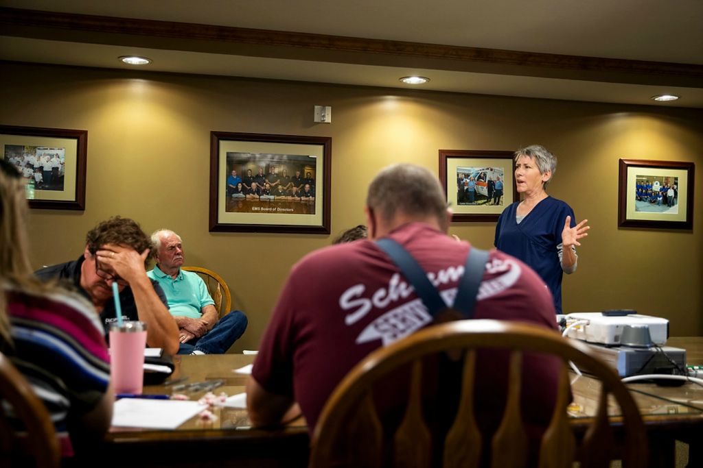 Third place, Feature Picture Story - Meg Vogel / The Cincinnati Enquirer, "Vaccine Hesitancy"Jennifer Profitt, president of Franklin County's health board, speaks at an EMS meeting about vaccine hesitancy at the Franklin County EMS offices on June 16, 2021, in Brookville, Indiana. When Profitt talks to community members about the vaccine, she believes the best way to make a case for the vaccine is to avoid arguing and stick to the science. Her message is simple: Most vaccinated people experience mild side effects and appear to get a high degree of protection from COVID-19. Many of the paramedics questioned the need for vaccinations.