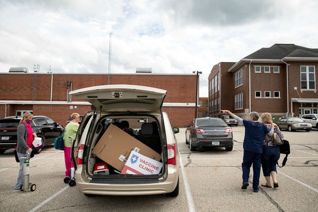 Third place, Feature Picture Story - Meg Vogel / The Cincinnati Enquirer, "Vaccine Hesitancy"The Franklin County Health Department team packs up their vehicles in Brookville, Indiana, to travel to Laurel for the town's first temporary vaccination clinic on June 7, 2021. Laurel is a town of 500 people in the northwest corner of Franklin county.