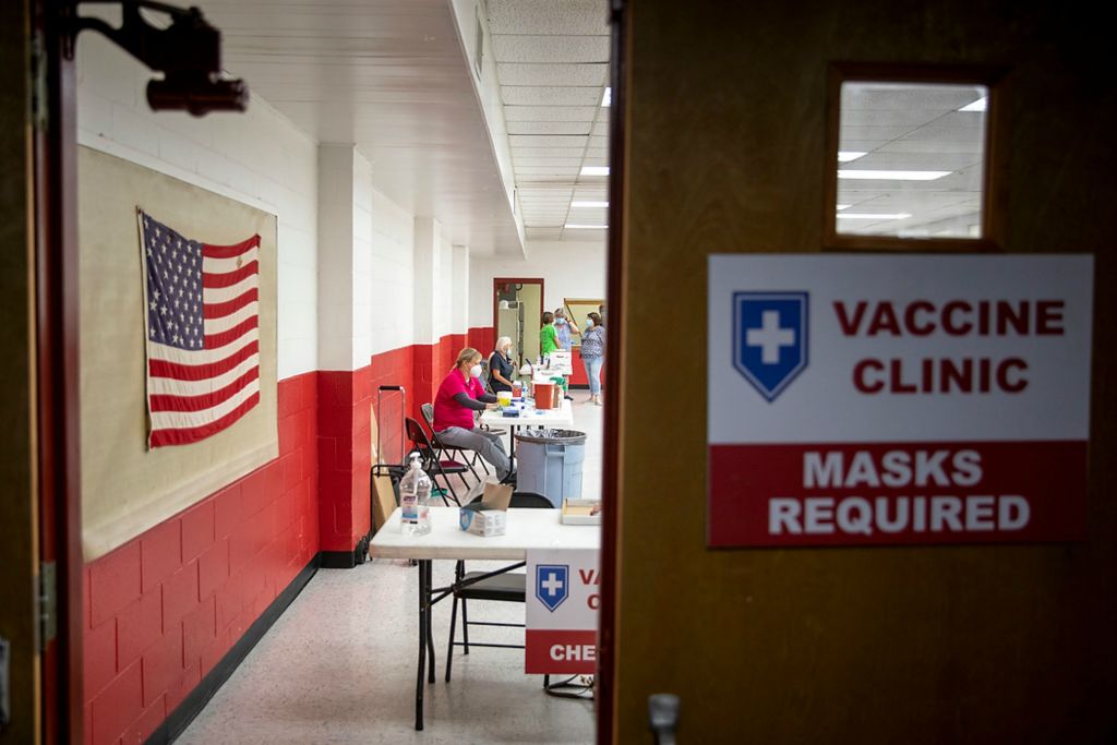 Third place, Feature Picture Story - Meg Vogel / The Cincinnati Enquirer, "Vaccine Hesitancy"Deb Tibbetts, a registered nurse with the Franklin County Health Department, waits for patients at the temporary vaccination clinic at the Laurel Community Center on June 7, 2021. The team brought 99 doses of the Johnson & Johnson COVID-19 vaccine. They administered 15 shots throughout the evening. 