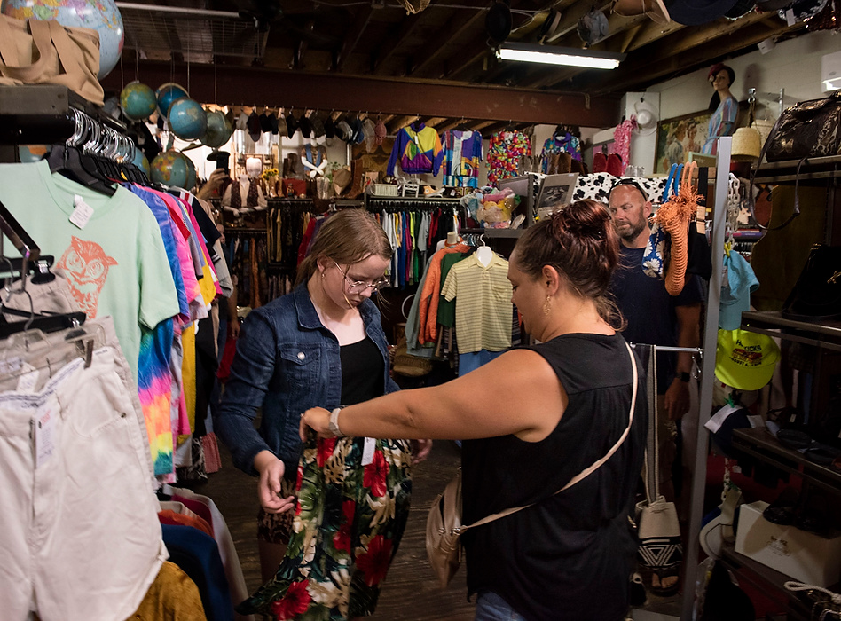 Award of Excellence, Feature Picture Story - Alie Skowronski / Ohio University, "New Normal"Joslynn and her donor parents, Kristy and Scott, shop at her favorite thrift store with her family in Columbus on  June 8, 2021. At the beginning of the pandemic, Joslynn was not able to go into stores because organ recipients have weak immune systems, but now she enjoys the time with her donor parents. When the decision to get the transplant was being made, Joslynn’s biggest request was to have a relationship with the donor parents. “Can I meet them?” she asked. “Can I meet the family where the liver came from?”