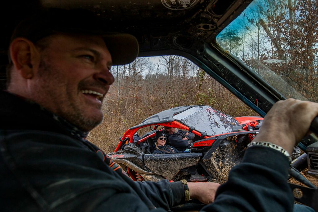 Second place, News Picture Story - Chris Day / Ohio University, "New Marshfield, Ohio"Ryan Peters jokes with his friends as they ride in their off-road vehicles through the trails at an Athens County Crawlers event on March 13, 2021. The ACC is an off-road park outside of New Marshfield where Athens County residents and people from throughout southern Ohio can bring their rigs to ride through the mud and scale hills of different difficulty.