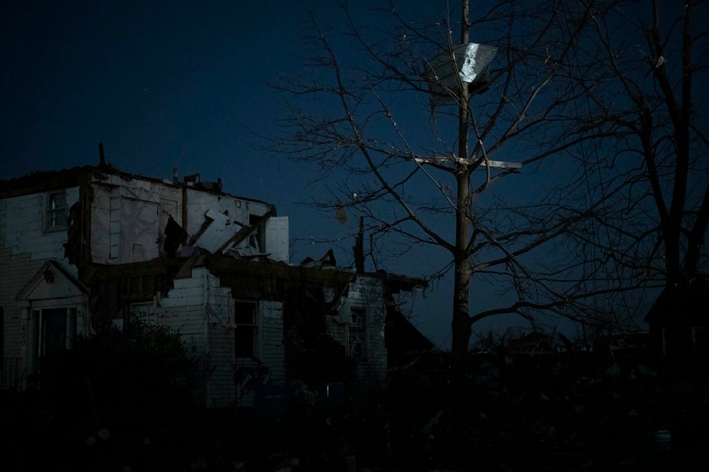 Award of Excellence, News Picture Story -  / , "Tornado"Metal siding sits in a tree at dusk.