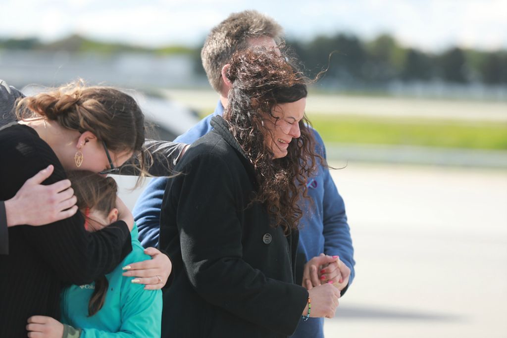 Award of Excellence, News Picture Story - Doral Chenoweth / The Columbus Dispatch, "Kaylie Harris"Carey Harris cries as casket bearers prepare to place her daughter Kaylie's body in a hearse for the ride from John Glenn International Airport in Columbus to a funeral home in Springfield on May 11, 2021. Kaylie Harris was an Army MP stationed in Anchorage. She alleged that she was raped by a colleague, an Airman, in January shortly after coming out on social media. Harris's family believes the rape was also a hate crime directed at her because she was lesbian. She printed a suicide note on May 2, 2021 and was found with a gunshot wound to her head. 