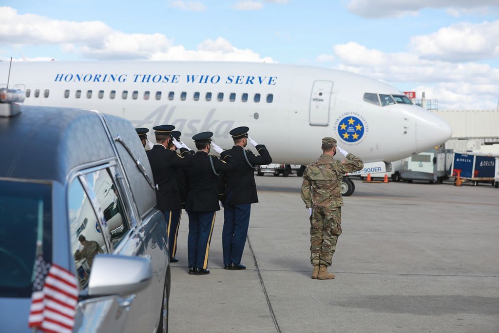 Award of Excellence, News Picture Story - Doral Chenoweth / The Columbus Dispatch, "Kaylie Harris"At John Glenn International Airport in Columbus, Ohio, casket bearers await the arrival of an airplane carrying the casket of Kaylie Harris on May 11, 2021. Kaylie Harris was an Army MP stationed in Anchorage. She alleged that she was raped by a colleague, an Airman, in January shortly after coming out on social media. Harris's family believes the rape was also a hate crime directed at her because she was lesbian. She printed a suicide note on May 2, 2021 and was found with a gunshot wound to her head. She is from Springfield. 