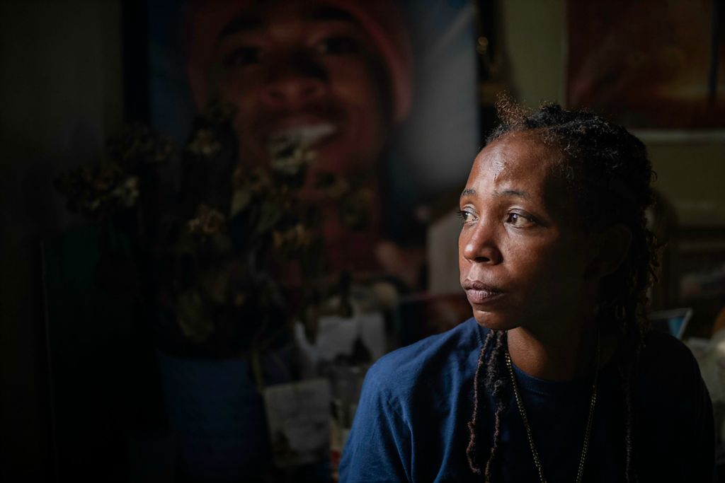 First place, Photographer of the Year - Large Market - Joshua A. Bickel / The Columbus DispatchRachelle Knight poses for a portrait in front of a home shrine to her 19-year-old son, Dontreal Calhoun, on Oct. 11, 2021 in Columbus, Ohio. Calhoun, 19, was shot and killed on Jan. 3, 2021, left to die next to a trash can in a dark alley, the city’s fifth homicide in the first three days of the new year. "It's still breaking my heart," Knight said. "I still see that every day and every night, that moment. I still see it." In 2021, 204 people's deaths were recorded as homicides in Columbus, surpassing the previous year’s record of 175 people.