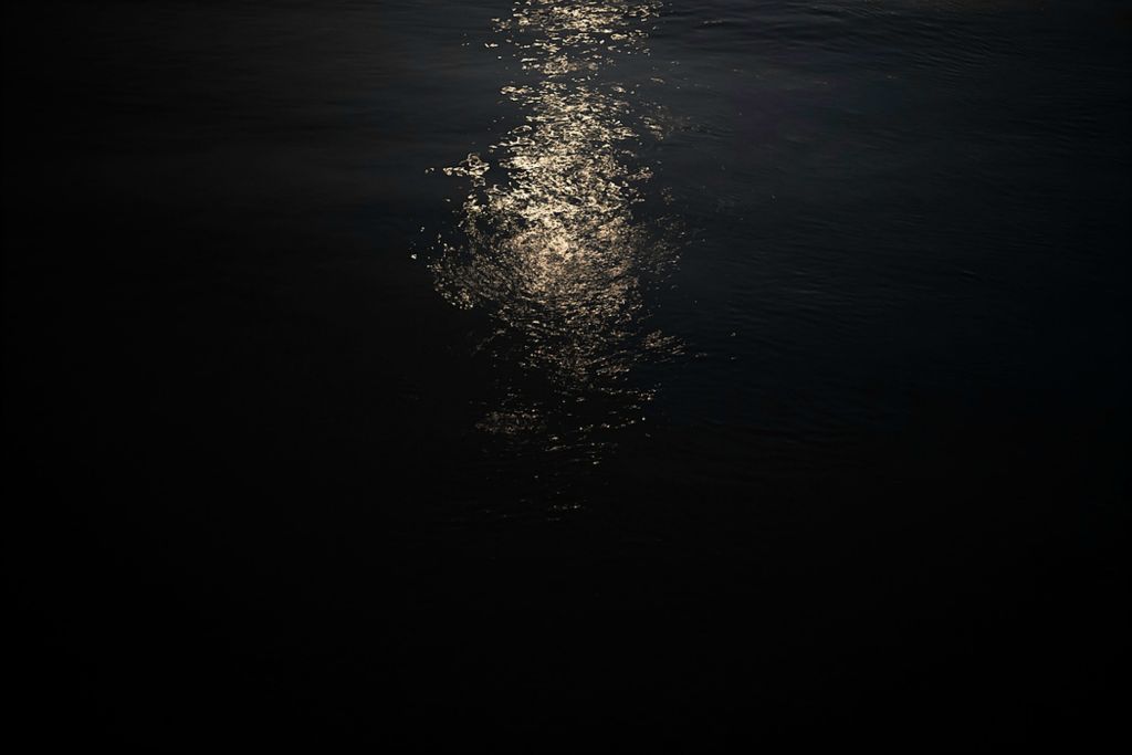 First place, Photographer of the Year - Large Market - Joshua A. Bickel / The Columbus DispatchMoonlight reflects off the Ohio River as seen from the house barge’s roof deck.