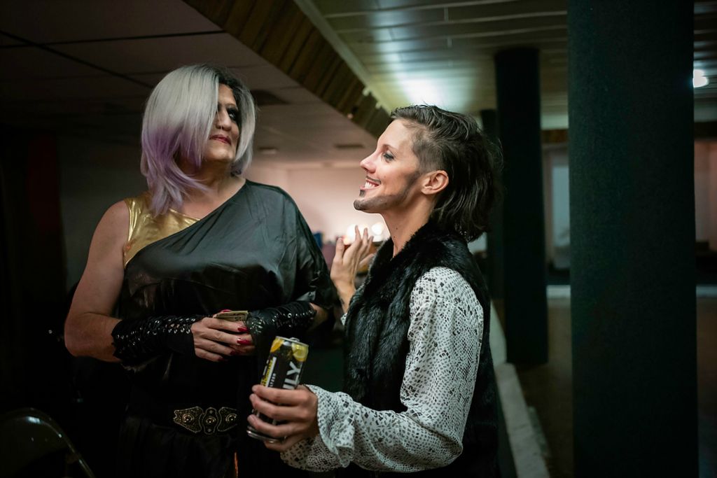 First place, Photographer of the Year - Large Market - Joshua A. Bickel / The Columbus DispatchJess (center) relaxes with Jay Bowman, who helped organize the show, before heading on again during the First Capital Pride Coalition's Drag Show. As the show winds down, many of the performers chatted and drank with one another, marveling at the support and strength of the LGBTQ community in the town. “To think about the younger people, the ones who might have a bad home life, who don't know who they are just yet…to know there is a community of support is amazing,” Jess said.  