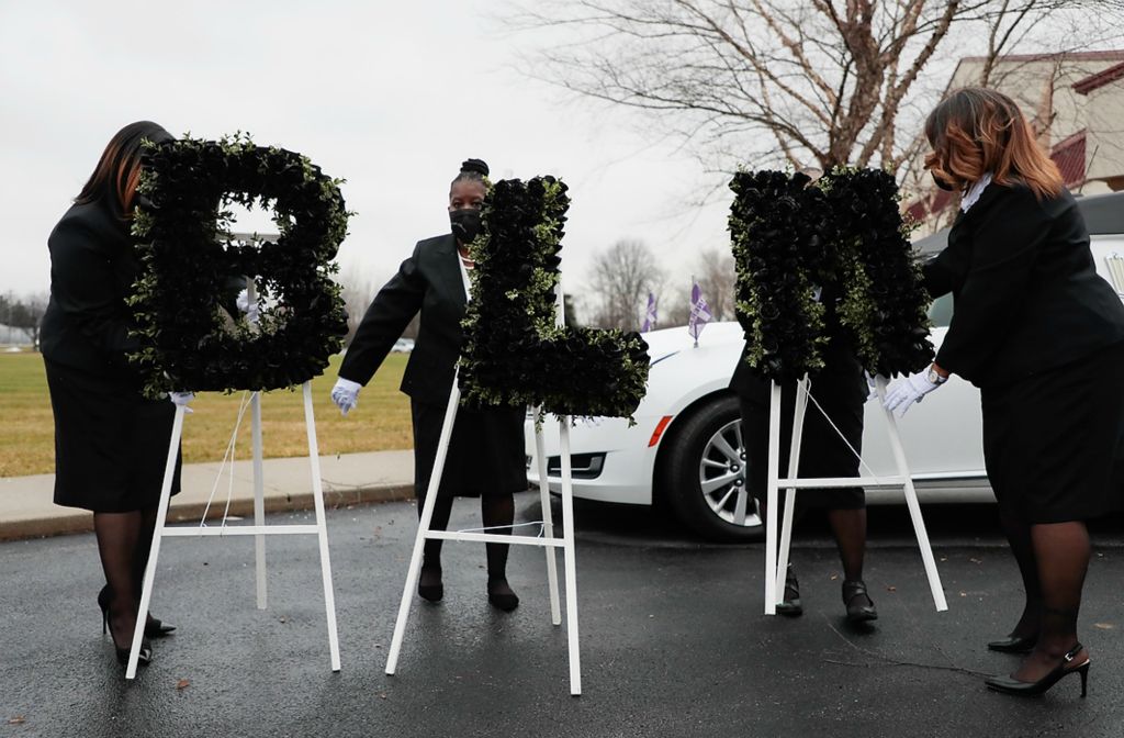 First place, Photographer of the Year - Large Market - Joshua A. Bickel / The Columbus DispatchChurch staff arrange flowers that speak out “BLM” before the cast of Andre’ Maurice Hill is brought to a hearse following his funeral on Jan. 5, 2021 at First Church of God in Columbus, Ohio. Hill, a 47-year-old Black man, was shot and killed by Columbus Division of Police Officer Adam Coy in the early morning of Dec. 22, 2020 after officers responded to a non-emergency call in the 1000 block of Oberlin Drive. According to body-worm camera footage from Officer Coy, Hill is seen inside a garage with his cell phone visible in his left hand and is shot within seconds of the interaction. Several minutes pass before any aid is rendered to Hill, who was known to the residents of the house and was expected to be there. Coy has been terminated from the division for his involvement in the killing.
