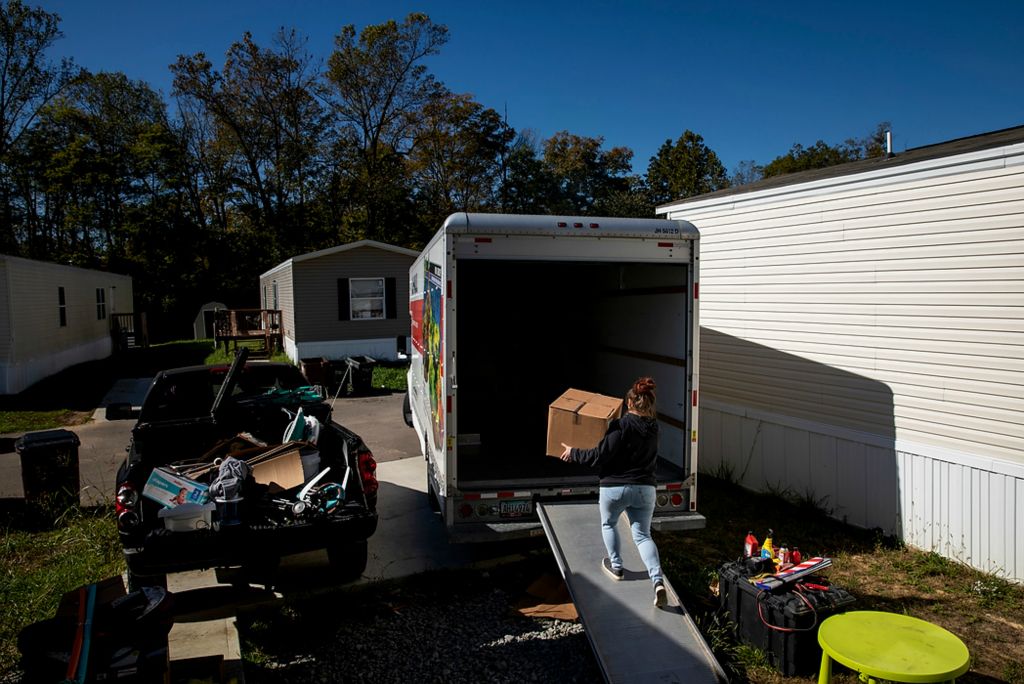 Second place, Photographer of the Year - Large Market - Meg Vogel / The Cincinnati EnquirerKendra Tucker loads a U-Haul truck with her boyfriend, Brandon Schuler after being evicted from their home at Westbrook Village Mobile Home Park in Cleves, Ohio, on Tuesday, October 19, 2021. The couple has until Friday to vacate their three-bedroom mobile home. Schuler has been renting at the Westbrook Village for the past two years. Westbrook's landlord has filed the highest number of eviction lawsuits against tenants since the pandemic began. Hamilton County has seen a wave of eviction filings since the CDC eviction moratorium was lifted. 