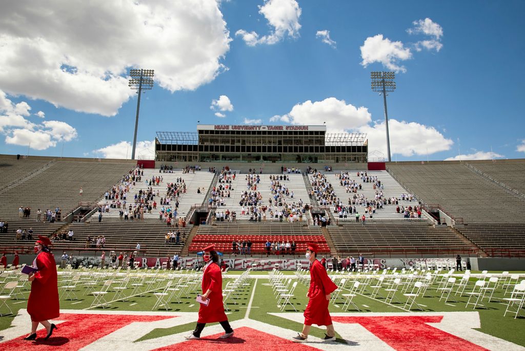 Second place, Photographer of the Year - Large Market - Meg Vogel / The Cincinnati EnquirerMiami University students graduate from the College of Creative Arts at Yager Stadium on Friday, May 14, 2021 at Miami University in Oxford, Ohio. The graduation was outside to accommodate COVID-19 protocols. It was the first ceremony Miami University held after canceling the 2020 commencement. 