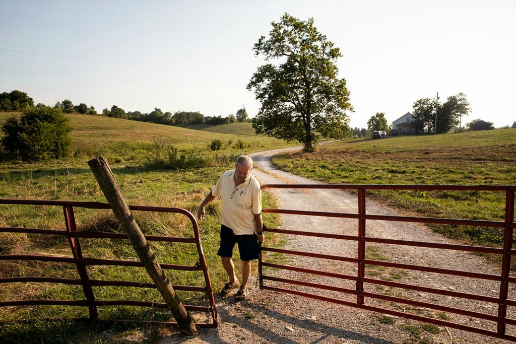 Second place, Photographer of the Year - Large Market - Meg Vogel / The Cincinnati EnquirerSkip Kuster closes the gate to his farm in Harrison County, Ky., on Sunday, August 8, 2021. Skip and Sylvia Kuster currently lease most of their 400-acre property to tenant farmers, but the money hasn't been enough to cover the costs of repairs on barns, fences and fields. The Kusters hoped to lease their land for solar but were blocked by a neighbor, who did not permit the solar company to cross part of their land to connect to the electrical grid. Sylvia Kuster believes that without the funds from solar, she and Skip will eventually lose their farm. “It's been a heartbreaker.” 