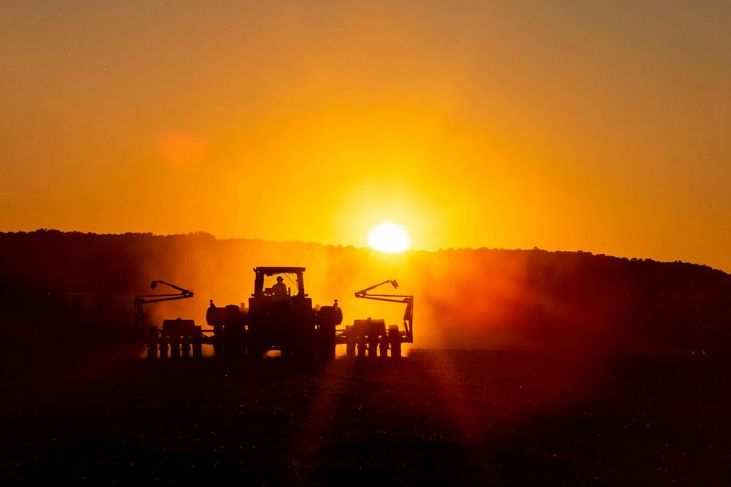 Second place, Photographer of the Year - Large Market - Meg Vogel / The Cincinnati EnquirerA farmer plows a field as the sun sets on Tuesday, June 15, 2021 in Brookville, Indiana. 