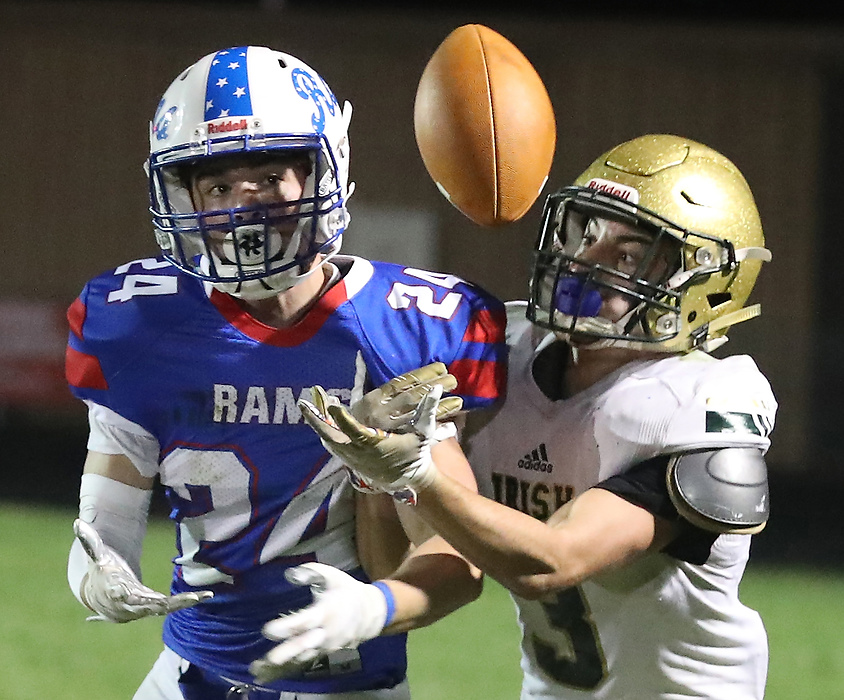 First place, Photographer of the Year - Small Market - Bill Lackey / Springfield News-SunGreeneview's Craig Finley and Catholic Central's Ashton Young battle for a pass during Friday's game. 