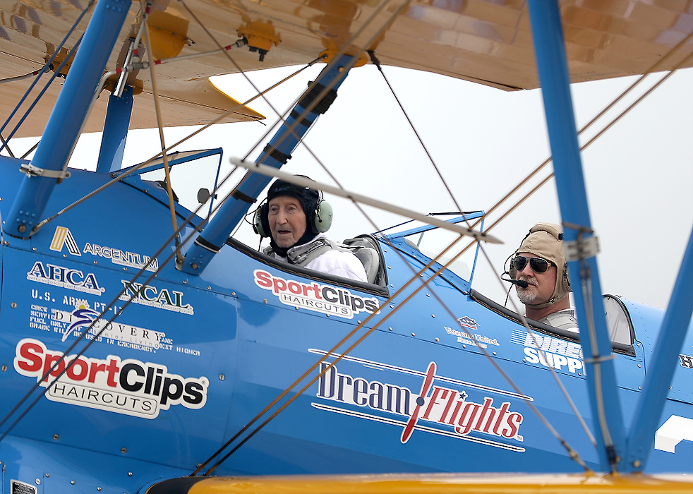 First place, Photographer of the Year - Small Market - Bill Lackey / Springfield News-SunWorld War II veteran Ed Fisher gets ready to take off with Ageless Aviation Dreams Foundation pilot Darryl Fisher in a restored Boeing Stearman biplane at Grimes Field in Urbana. 