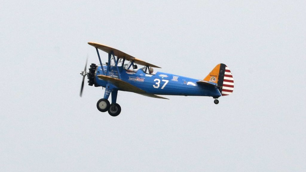 First place, Photographer of the Year - Small Market - Bill Lackey / Springfield News-SunWorld War II veteran Ed Fisher flies with the Ageless Aviation Dreams Foundation in a restored Boeing Stearman biplane at Grimes Field in Urbana.