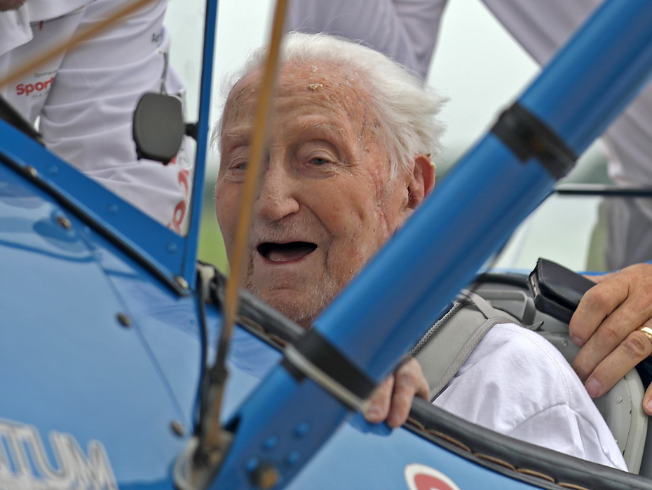 First place, Photographer of the Year - Small Market - Bill Lackey / Springfield News-SunThe smile says it all as World War II veteran Ed Fisher, who recently turned 100 years-old, lands after taking his Dream Flight in a restored Boeing Stearman biplane at Grimes Field in Urbana. 