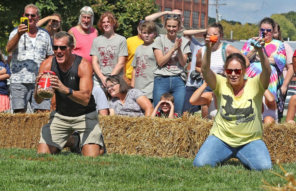 First place, Photographer of the Year - Small Market - Bill Lackey / Springfield News-SunTo wiener dog owners shook treats and squeeked favorite toys to get the dogs to sprint down the track for the 2021 Champion City Wiener Dog Races. 
