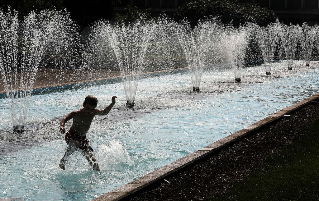 First place, Photographer of the Year - Small Market - Bill Lackey / Springfield News-SunA young boy cools off by playing in the fountain on City Hall Plaza along Main Street in Springfield. The boys family was sitting at a nearby picnic table. 