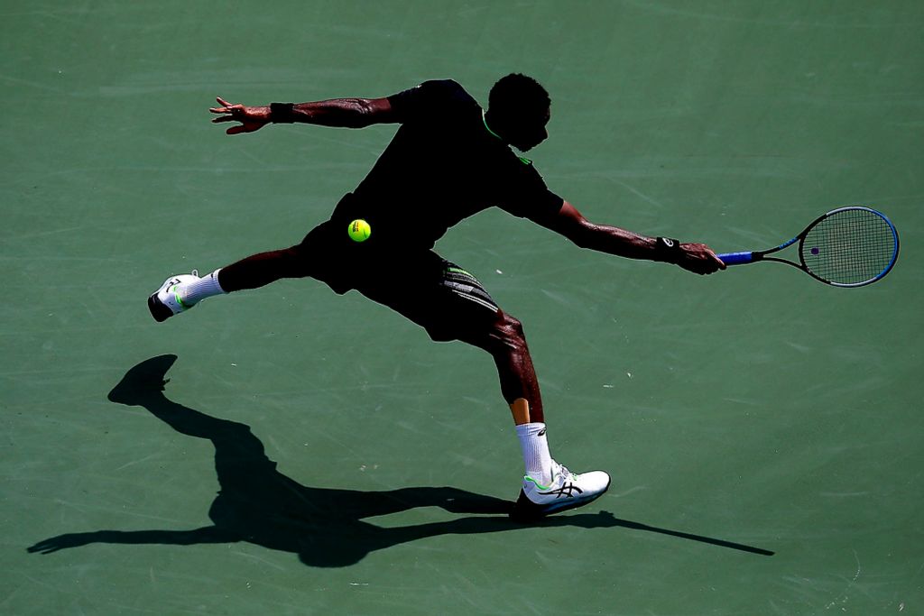 Third place, Sports Action - Sam Greene / The Cincinnati Enquirer, "Backhand"Gael Monfils (FRA) returns a shot in the first set of a match against Andrey Rublev (RUS) in the Western & Southern Open at the Lindner Family Tennis Center in Mason on Thursday, Aug. 19, 2021
