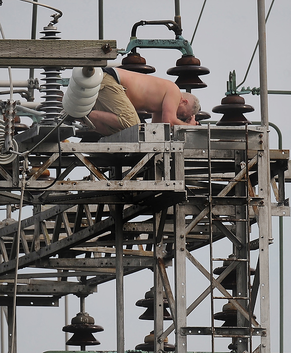 Third place, Spot News - Marshall Gorby / Dayton Daily News, "Crazy Man"A man climbed atop an Ohio Edison power substation in Moorefield Township on Oct. 11, 2021. After nearly four hours, negotiators talked him down safely. Electricity to nearly 2,500 customers had been cut off during the standoff. 