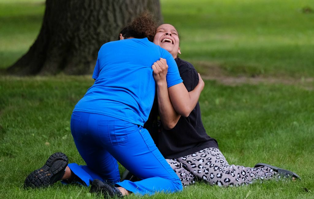 Award of Excellence, Spot News - Dave Zapotosky / The Blade, "Homicide Reaction"A distraught woman is comforted after Toledo police found a homicide victim in Ottawa Park, June 23, 2021. Family at the park dentified the victim as Theodore Walker, Jr., 36. 