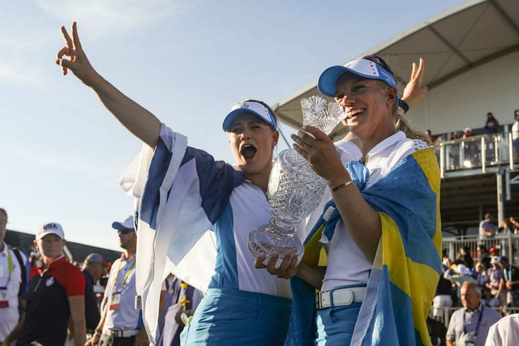 First place, Ron Kuntz Sports Photographer of the Year - Rebecca Benson / The BladeTeam Europe’s Matilda Castren (left) and Madelene Sagstrom celebrate their 14-13 win over Team USA during the trophy presentation for the 2021 Solheim Cup at Inverness Club in Toledo on September 6, 2021. 