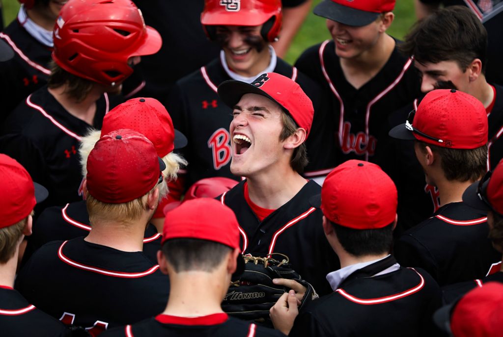 First place, Ron Kuntz Sports Photographer of the Year - Rebecca Benson / The BladeBowling Green’s Michael Becker (center) cheers with his teammates before the Division I High School baseball regional semifinal against St. John’s at BGSU’s Warren Steller Field in Bowling Green on June 4, 2021. 