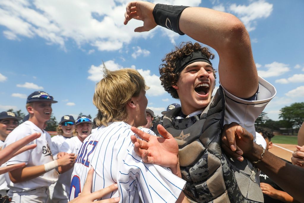 First place, Ron Kuntz Sports Photographer of the Year - Rebecca Benson / The BladeSt. John's Jesuit’s Reece DiSalle (right) celebrates their 4-3 win over Berea-Midpark in the Division I regional final at BGSU’s Warren Steller Field in Bowling Green on June 5, 2021. 