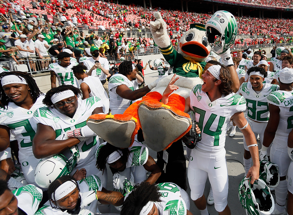 Second place, Ron Kuntz Sports Photographer of the Year - Adam Cairns / The Columbus DispatchOhio State Buckeyes players carry the duck mascot off the field following their 35-28 win over the Ohio State Buckeyes in the NCAA football game at Ohio Stadium in Columbus on Sept. 11, 2021.