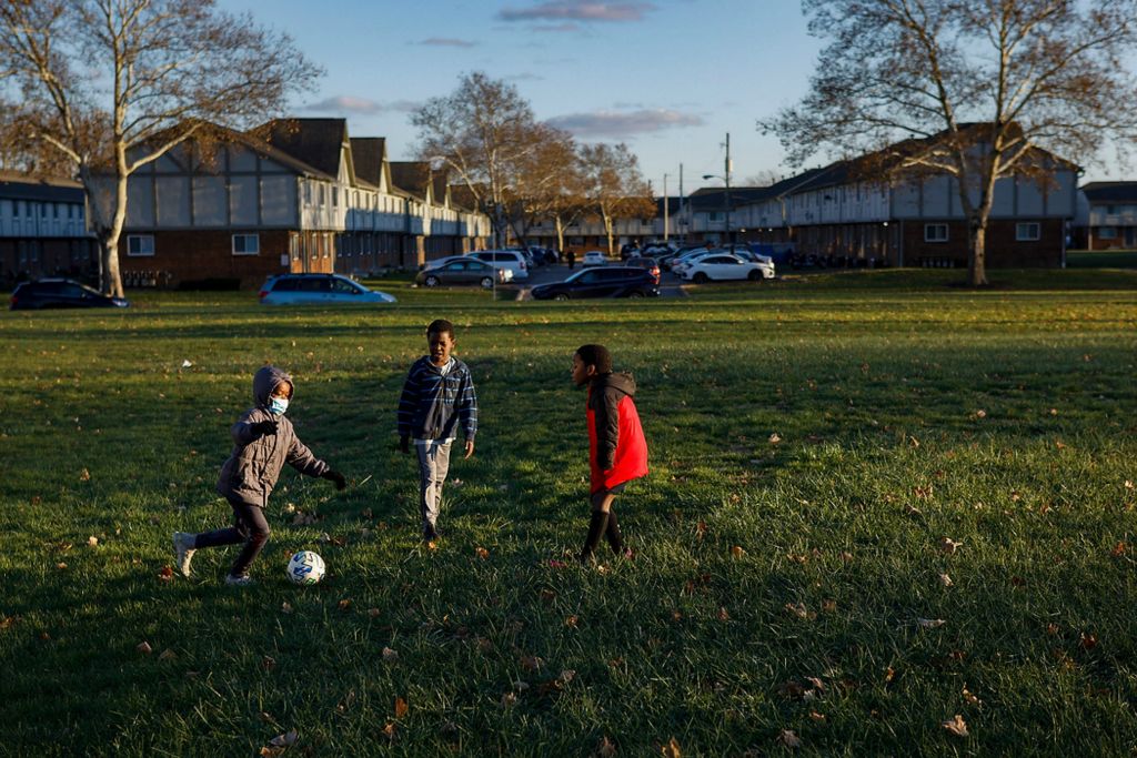 Second place, Ron Kuntz Sports Photographer of the Year - Adam Cairns / The Columbus DispatchSoccer is a popular activity for underprivileged kids in the Hilltop, like these at Havenwood Townhomes, on Nov. 22. My Project USA funds the Hilltop Tigers soccer program to keep kids active and out of trouble year round.