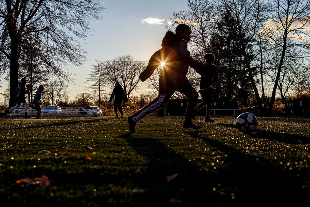 Second place, Ron Kuntz Sports Photographer of the Year - Adam Cairns / The Columbus DispatchSoccer is a popular activity for underprivileged kids in the Hilltop, like these on the field at Havenwood Townhomes, on Nov. 22. My Project USA funds the Hilltop Tigers soccer program to keep kids active and out of trouble year round. According to neighbors, the field gets used every day of the year regardless of weather.