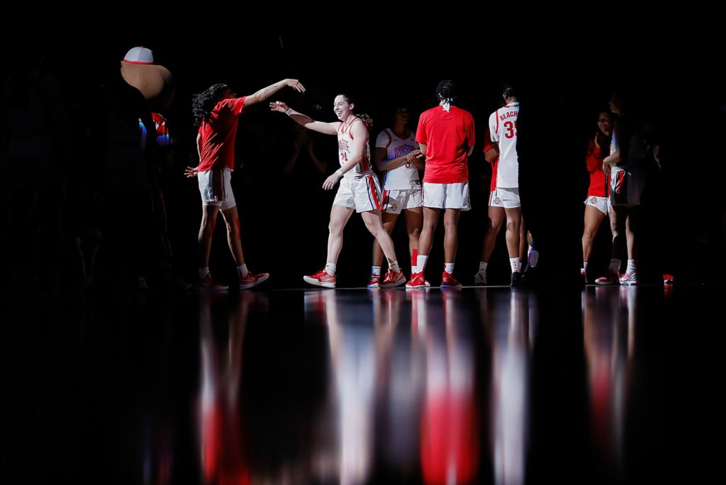 Second place, Ron Kuntz Sports Photographer of the Year - Adam Cairns / The Columbus DispatchOhio State Buckeyes guard Taylor Mikesell (24) is announced in the starting lineup prior to the NCAA women's basketball game against the Bowling Green Falcons at Value City Arena in Columbus Nov. 17, 2021. 