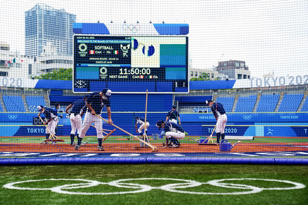 Third place, Ron Kuntz Sports Photographer of the Year - Kareem Elgazzar / The Cincinnati EnquirerThe grounds crew prepares the field for an opening-round softball game between Canada and Italy during the Tokyo 2020 Olympic Summer Games, July 26, 2021, at Yokohama Baseball Stadium in Yokohama, Japan.