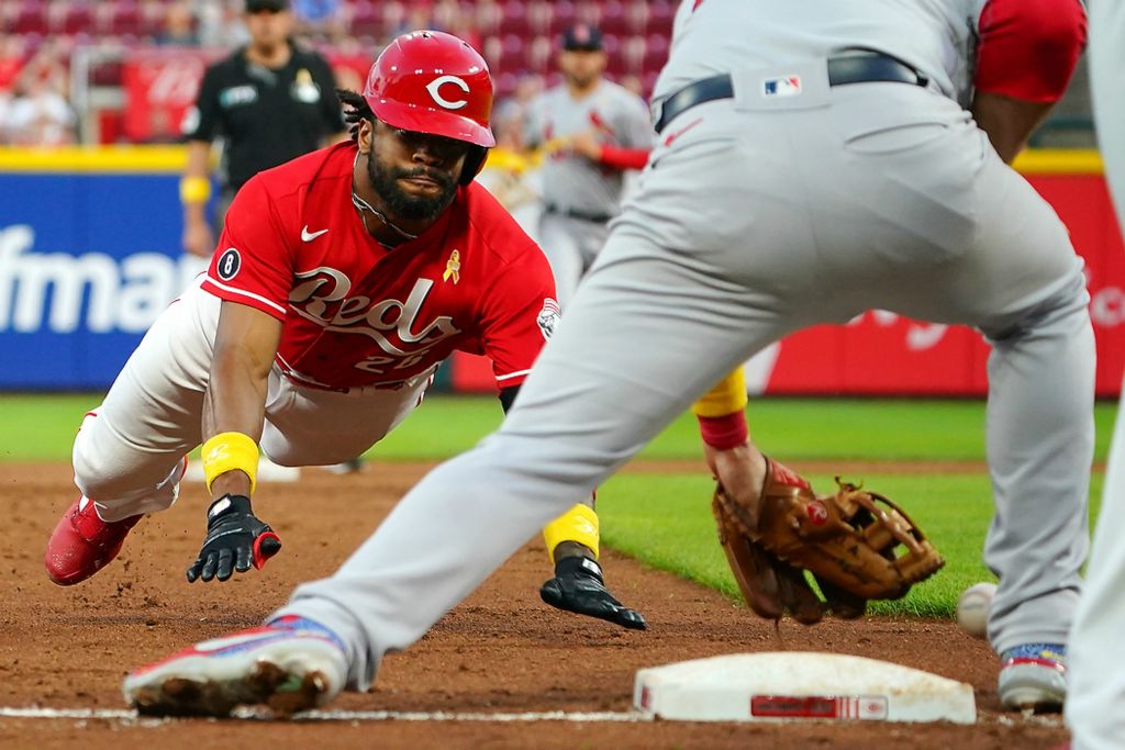 Third place, Ron Kuntz Sports Photographer of the Year - Kareem Elgazzar / The Cincinnati EnquirerCincinnati Reds center fielder Delino DeShields (26) advances to third base on a throwing error after hitting a double in the second inning of a game against the St. Louis Cardinals, Sept. 1, 2021, at Great American Ball Park in Cincinnati. The Cincinnati Reds won, 12-2. 