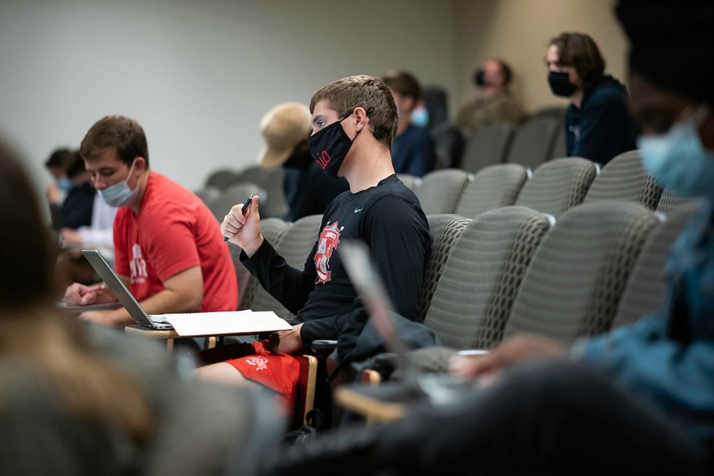 First place, Sports Picture Story - Joshua A. Bickel / The Columbus Dispatch, “Austin Bowman Leads the Way”Austin Bowman listens during a lecture in his intermediate microeconomics theory class. Along with his full slate of classes, Austin has to balance about 20 hours a week of dedicated band rehearsal time along with extra time spent choreographing his performance, planning practices for the other drum majors and his own physical conditioning.