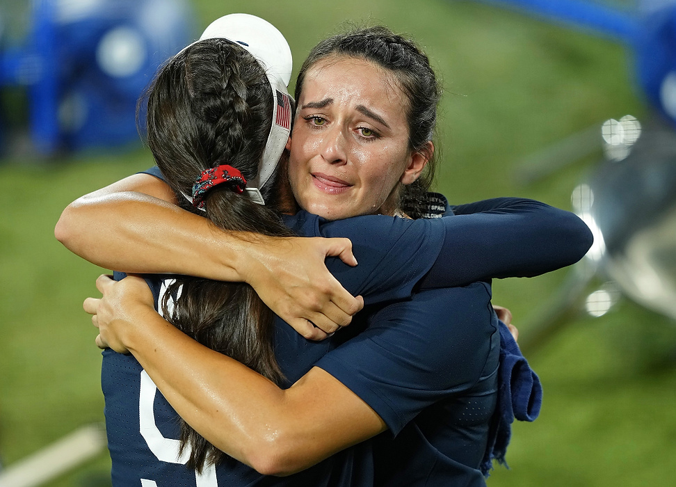 Second place, Sports Picture Story - Kareem Elgazzar / Kareem Elgazzar-USA TODAY Sports, “Olympic Softball”Team United States left fielder Janette Reed (left) hugs shortstop Delaney Spaulding (right) after their loss to Japan in the gold medal game of the Tokyo 2020 Olympic Summer Games, July 27, 2021, at Yokohama Baseball Stadium. Japan won 2-0. The Japanese defeated the Americans for the second consecutive Olympics.