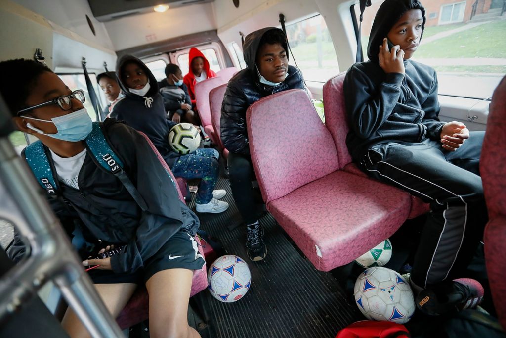 Third place, Sports Picture Story - Adam Cairns / The Columbus Dispatch, “Hilltop Tigers Soccer Program”Hilltop Tigers coach Ali Jeylani drives around the Hilltop, mainly in the Wedgewood and Havenswood housing communities, in a donated 2004 Ford E350 transport van picking up kids from the U16 soccer team to go to practice at Wilson Road Park on Nov. 4.