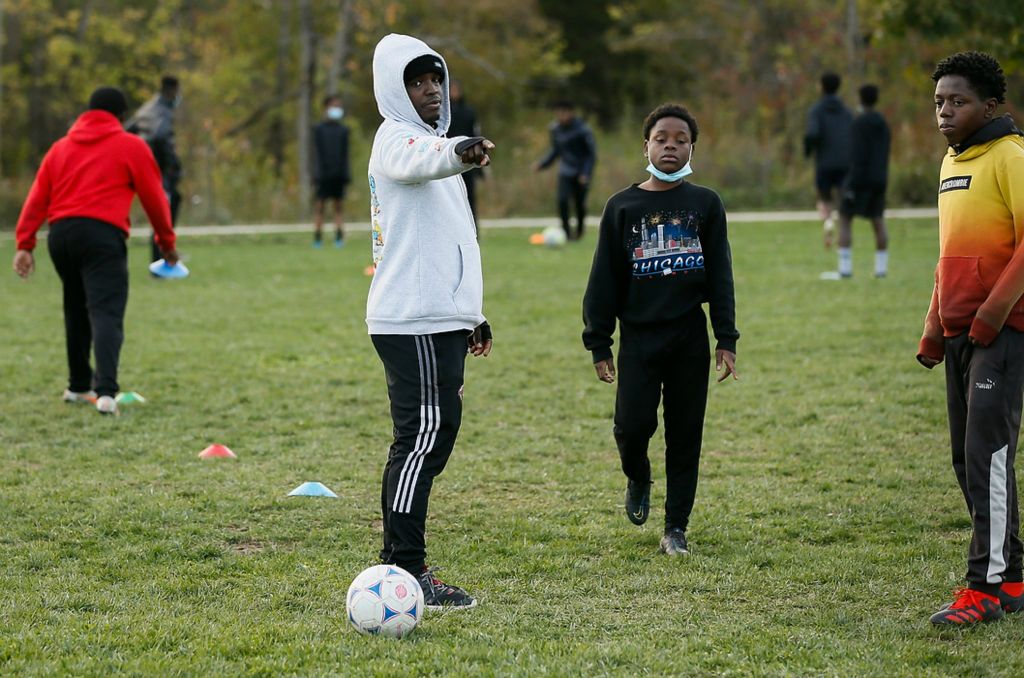 Third place, Sports Picture Story - Adam Cairns / The Columbus Dispatch, “Hilltop Tigers Soccer Program”Hilltop Tigers founder and co-director Siyat Mohamed helps coach soccer practice at Wilson Road Park on Nov. 4. The practice would end up being the final outdoor practice of the fall season due to early darkness and colder temperatures.