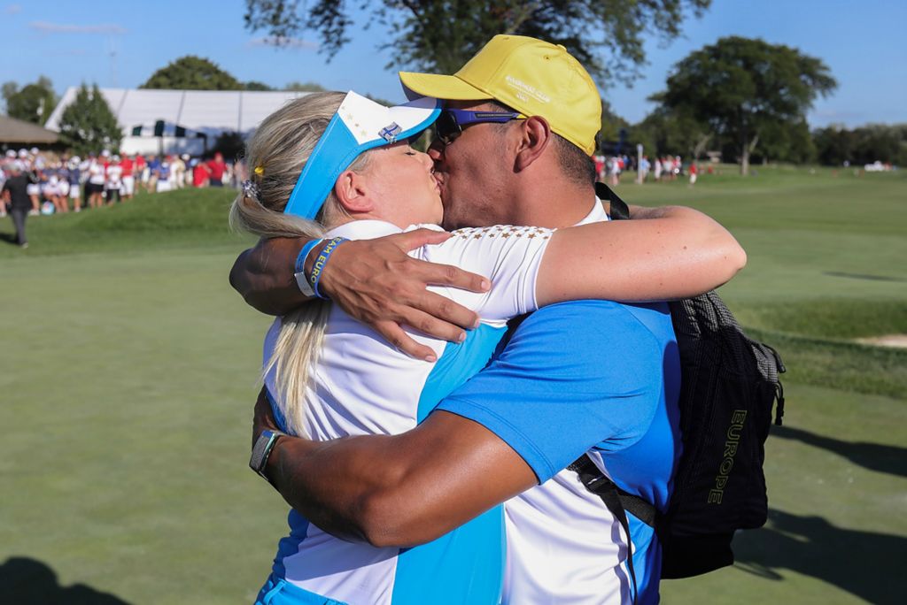 Award of Excellence, Sports Picture Story - Jeremy Wadsworth / The Blade, “Solheim Cup”Matilda Castren of Team Europe gets a celebratory kiss after securing the win for her team on the 18th hole during the final round of the Solheim Cup September 6, 2021, at the Inverness Club in Toledo. 