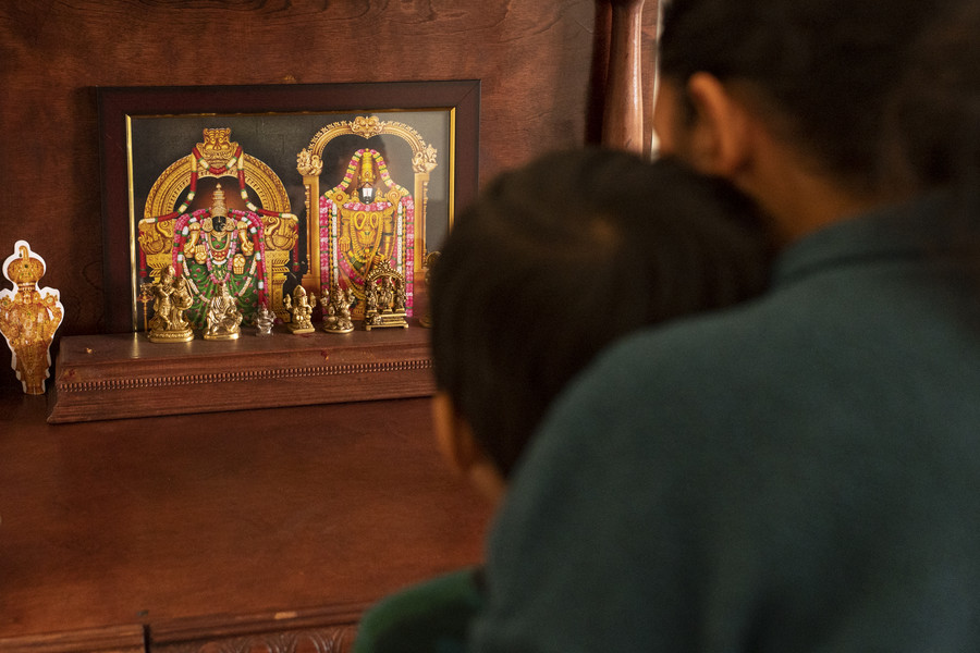 Student Photographer of the Year - First Place, Akash Pamarthy / Ohio UniversityRidhay Vemuri, 2, and his mother Keerthi Sanivarapu, 35, pray to the Indian deities in their prayer room at their residence in Novi, Michigan. 