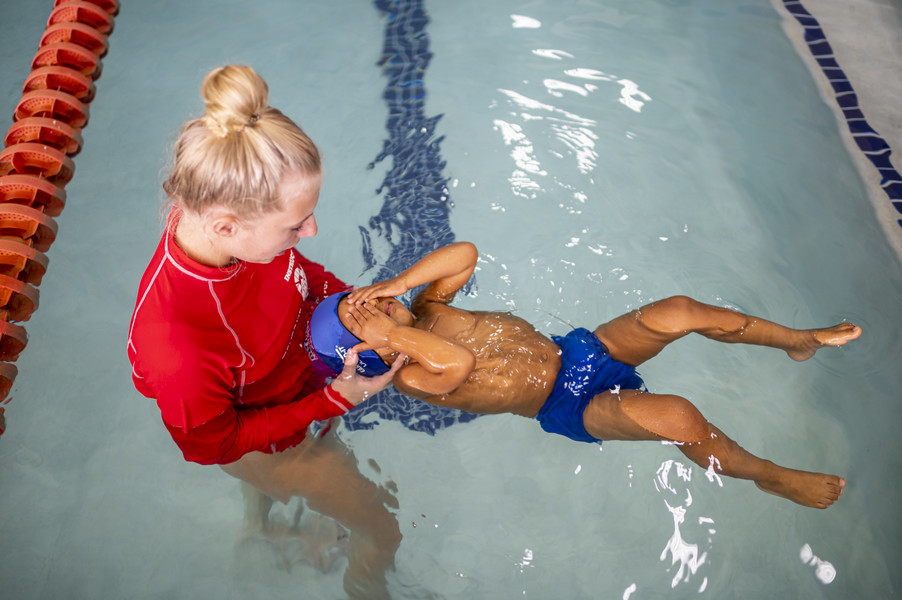 Student Photographer of the Year - First Place, Akash Pamarthy / Ohio UniversityRidhay Vemuri, 2, closes his eyes as his swim instructor Kylie Modreski, 15, holds him during his swimming class at the British swimming school. According to Ridhay’s parents, once he is at a conscious age to make his own decisions, they want him to embrace both the cultures and respect them. When he is outside of home, he is exposed to American culture but at home it is going to stay Indian. 