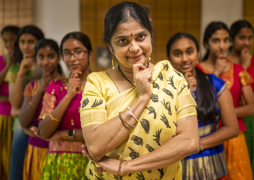 Student Photographer of the Year - First Place, Akash Pamarthy / Ohio UniversityPortrait of Sandhya Atmakuri (center) a Kuchipudi dance teacher from Rochester Hills, Michigan. She moved to the U.S in 1996 by marriage on dependent visa (H4 visa). She was not allowed to work on the visa status and wanted to go to law school, but it was not financially viable. She received her green card in 2001 and started her dance school in 2002 after observing parents wanting to teach their kids dance to keep them culturally connected to their homeland. Through her school Natyadharmi Foundation of Performing Arts, she has been teaching Michigan kids Kuchipudi and Bharatanatyam (Indian classical dance art forms). 
