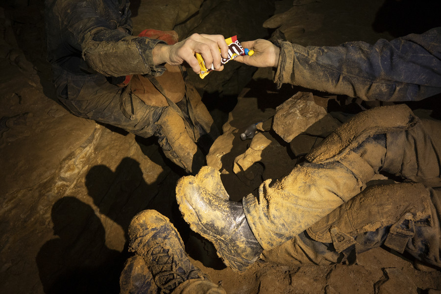 Student Photographer of the Year - Second Place, Joe Timmerman / Ohio UniversityMatt Mezydlo pours M&M’s into McClintock’s hand as the group of cavers take a snack and water break. 