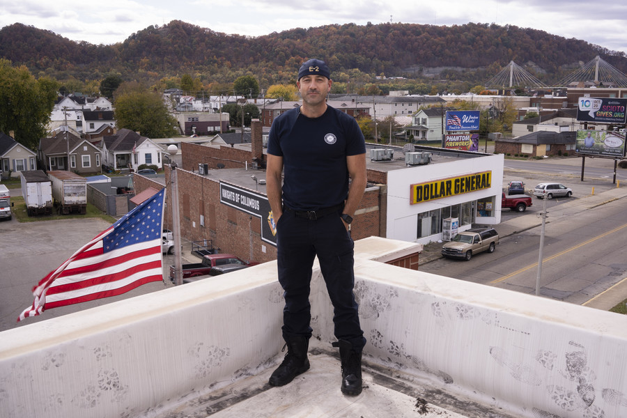 Student Photographer of the Year - Second Place, Joe Timmerman / Ohio UniversityCaptain Josh Sherman stands atop the Portsmouth Fire Department for a portrait. Captain Sherman helped develop and facilitate the quick response team with The Counseling Center about a year ago after having trouble decompressing following runs due to the high amount of overdoses. “We elicited the help of counselors, drug abuse counselors from the Counseling Center, and they formed a group of people that now respond to opioid related incidents or or drug related incidents and they provide resources. They provide immediate transport, comfort care, medications, medical assisted therapies for people who are in an act of addiction at that moment, providing alternatives to taking them to the hospital or taking them to jail,” Sherman said. “It gave us a second to take a breath and to understand the situation to understand the addict or the person with the substance abuse disorder. And to kind of see how the QRT interacts with those people and to see their empathy and to see their compassion for people that we just never considered to even have that for. To me, that was a big hurdle and once we kind of cleared that hurdle, we were able to function a little better.” 