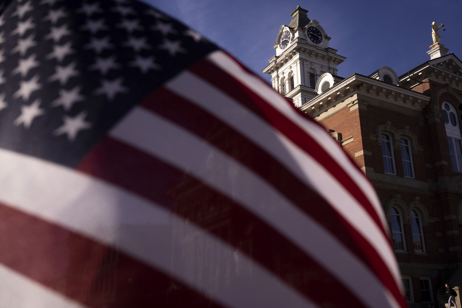 Student Photographer of the Year - Second Place, Joe Timmerman / Ohio UniversityAn American Flag waves across the street from the Athens County Courthouse on Election Day in Athens. 